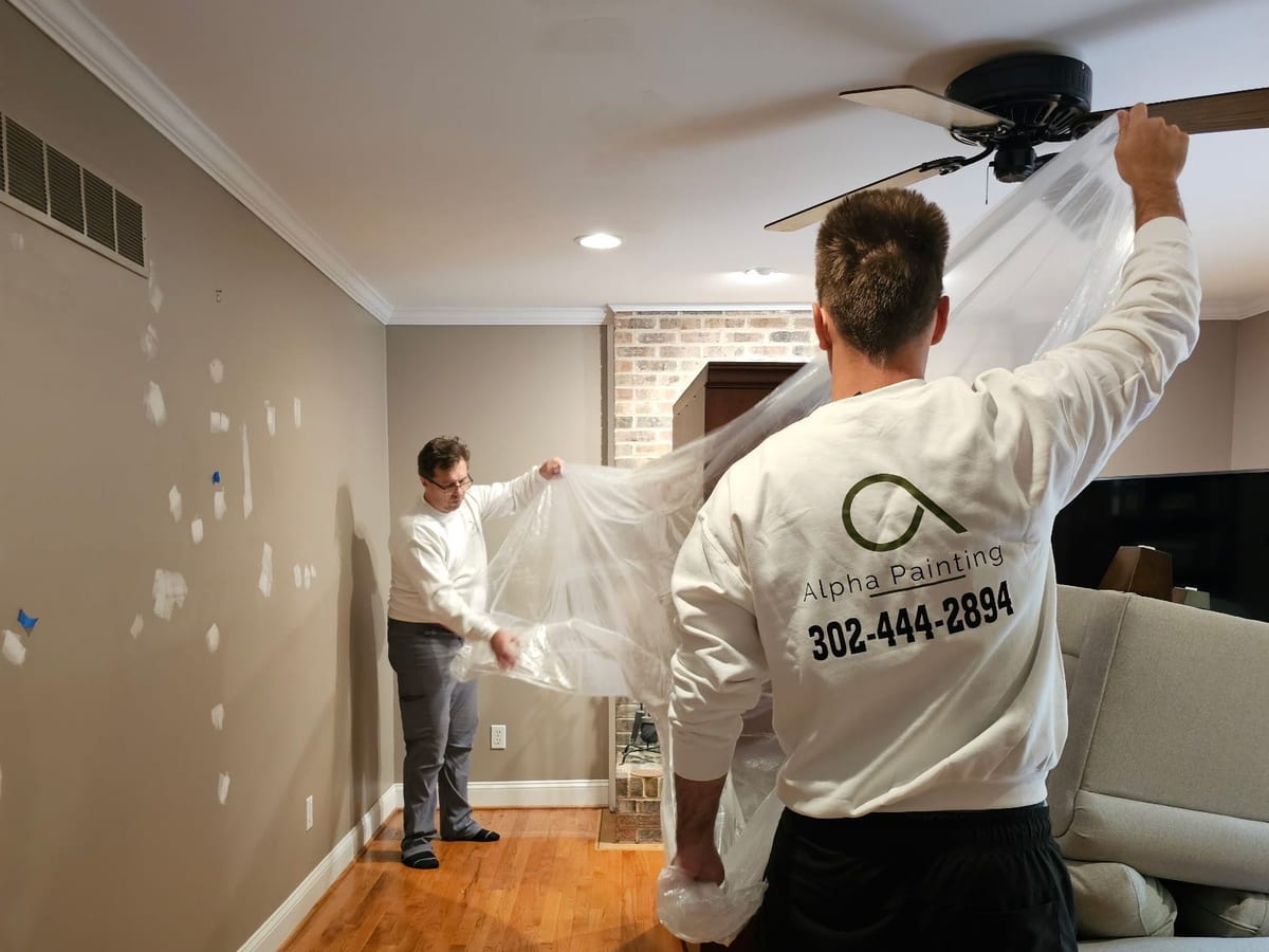 Alpha Painting masking a room before an interior repaint